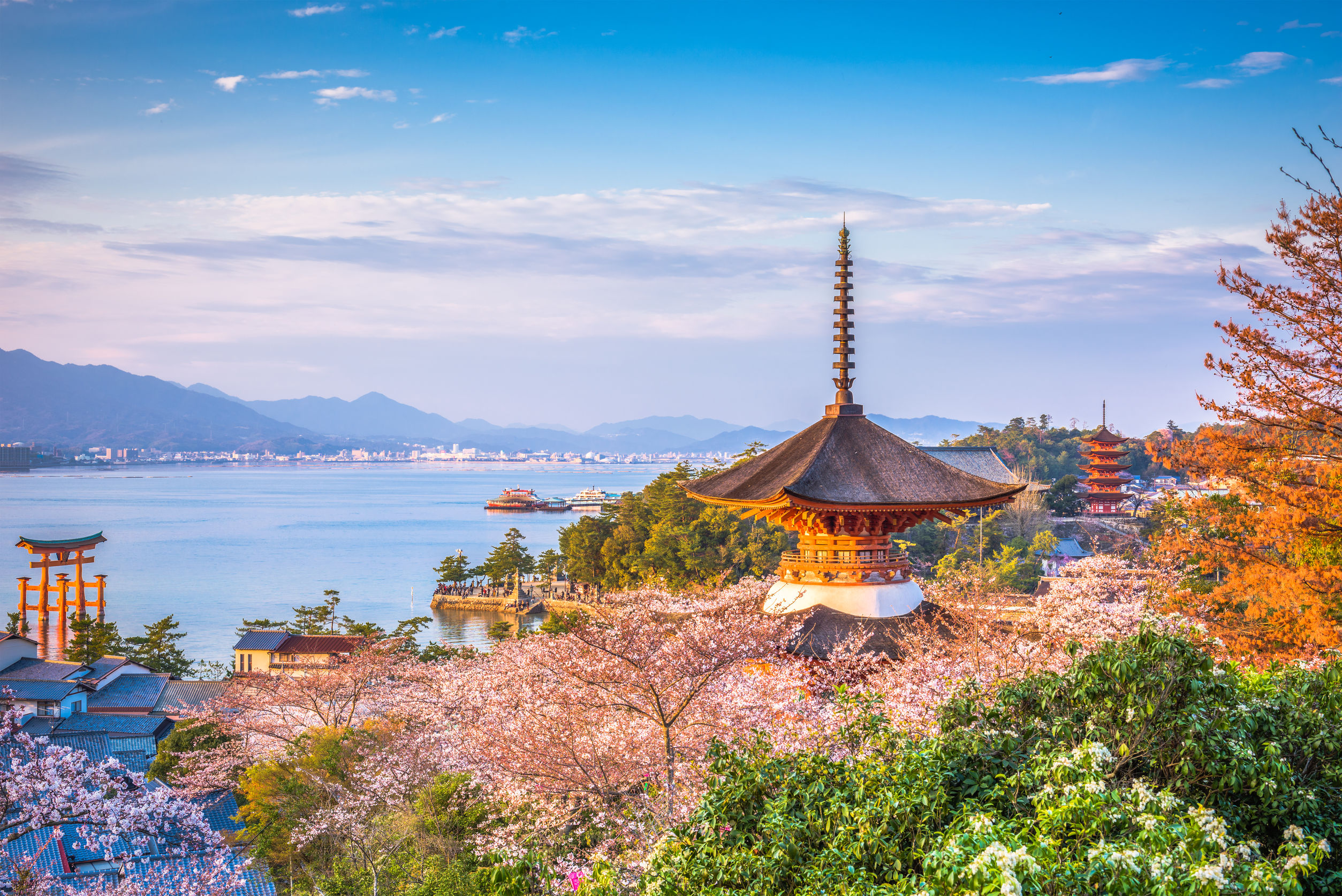 The sacred island of Miyajima and its famous torii with feet in water, worth a visit off Hiroshima in Japan