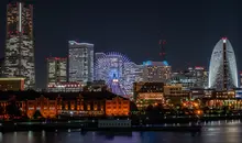 The lights of the city at night near along the waterfront.